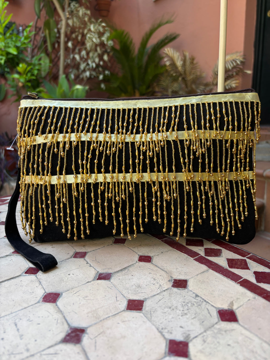 Cartera flecos dorados