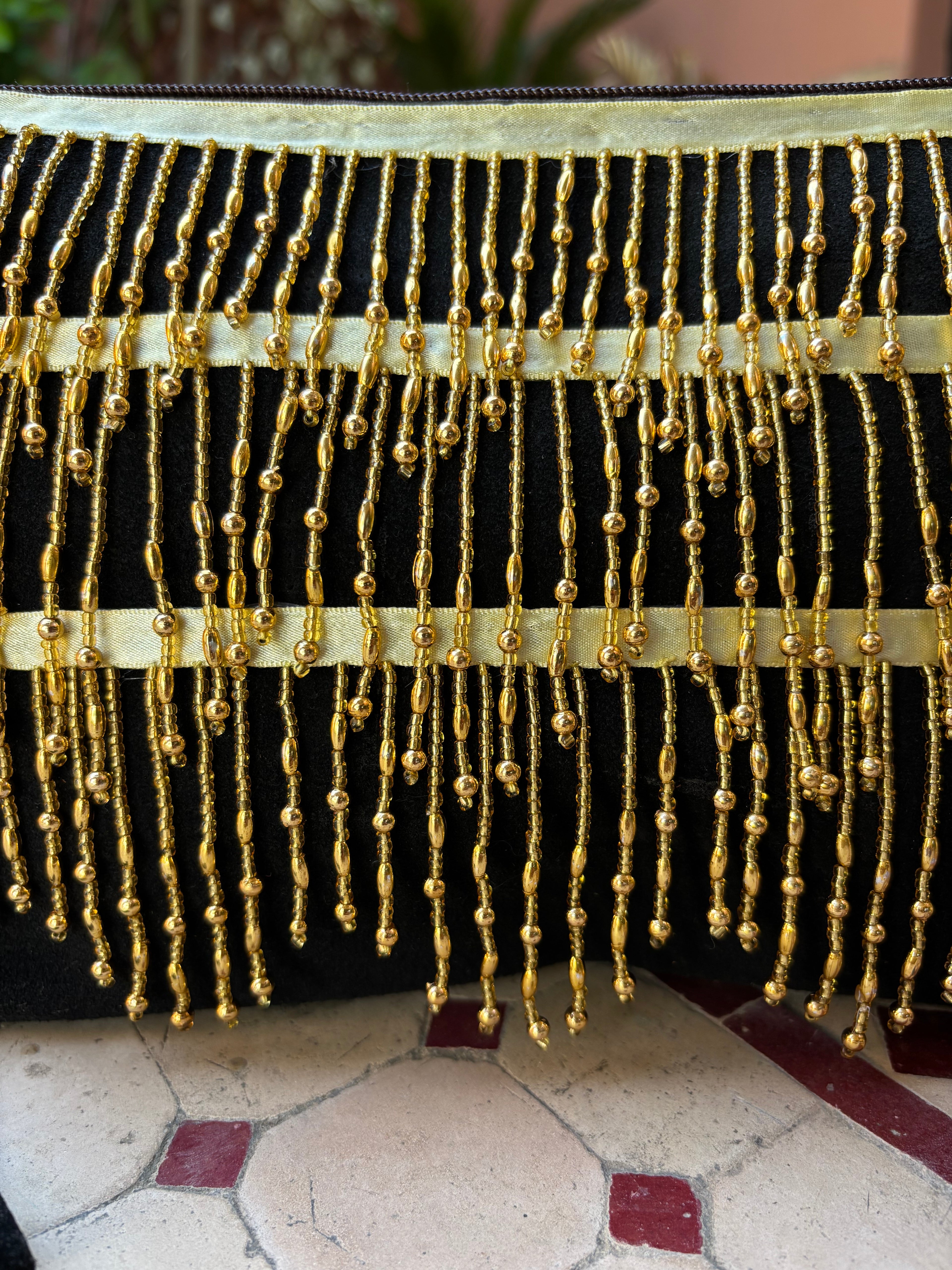Cartera flecos dorados