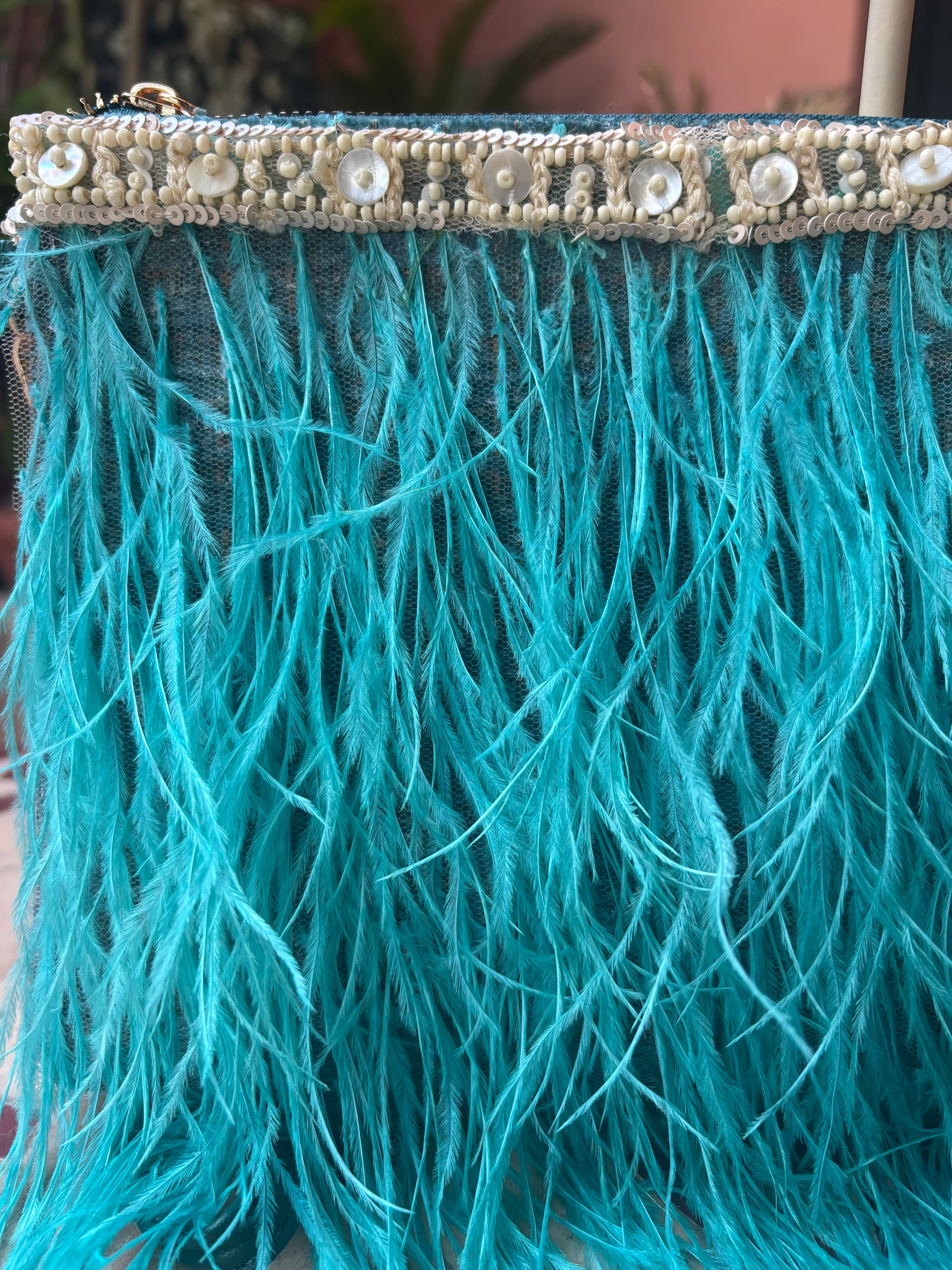 BOLSO PLUMA TURQUESA