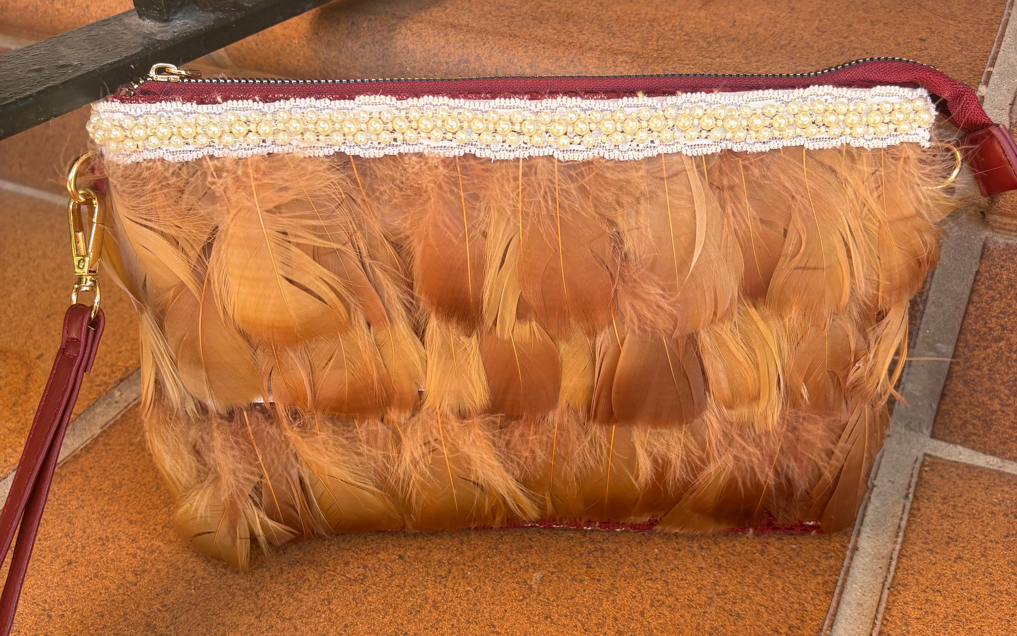 CARTERA PLUMAS Y PERLAS